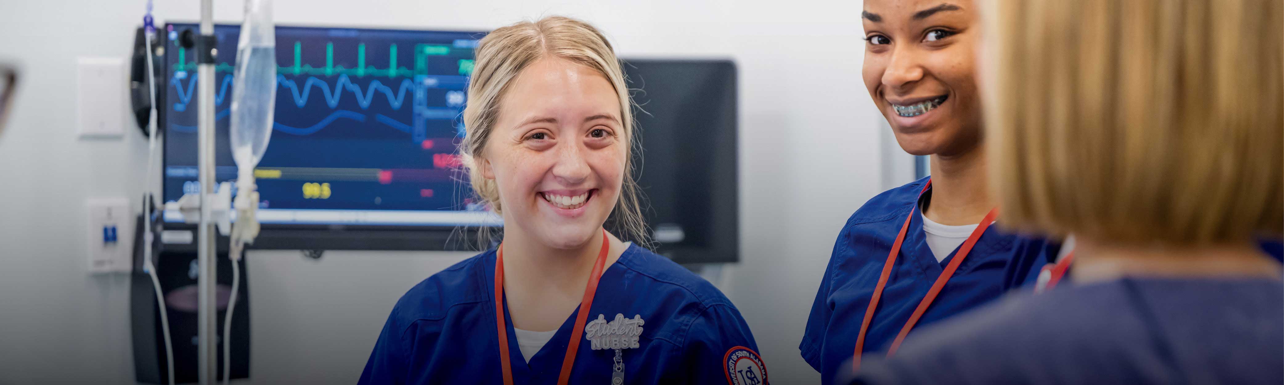 Student nurses working in medical setting.