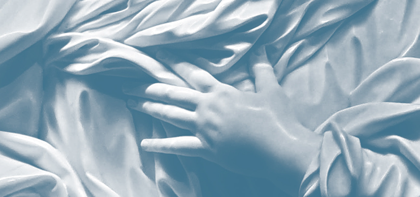 Hand of a baby on top of a blanket. data-lightbox='featured'