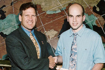 Jack Cullen (r) receives the 2003 ExxonMobil Junior Scholarship Award from Mike Leach (l), ExxonMobil plant manager.