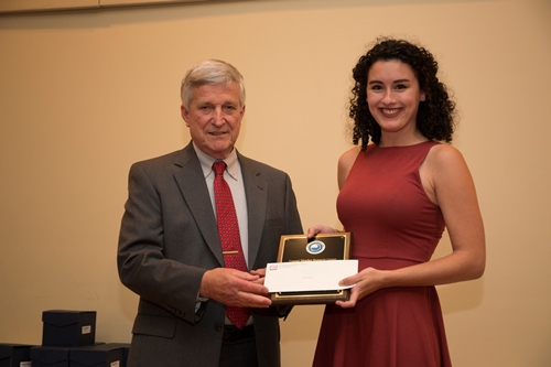 Dr. Bill Williams presents an Outstanding Senior Award to Alysa Carsley.