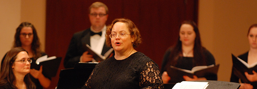Woman singing with choir