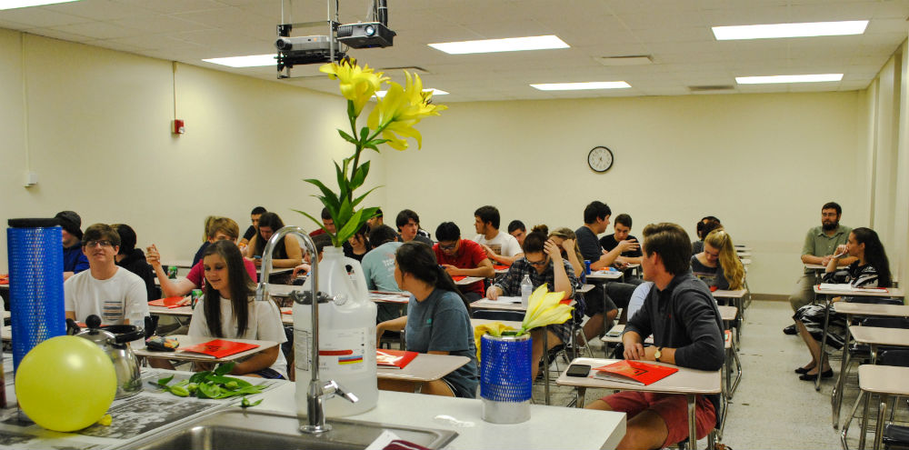 Students in classroom sitting at desks.