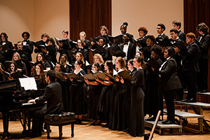 Students in performance clothese singing.