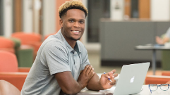 Place Holder Student sitting at computer facing front