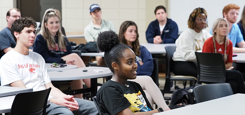 Students in classroom listening to professor.