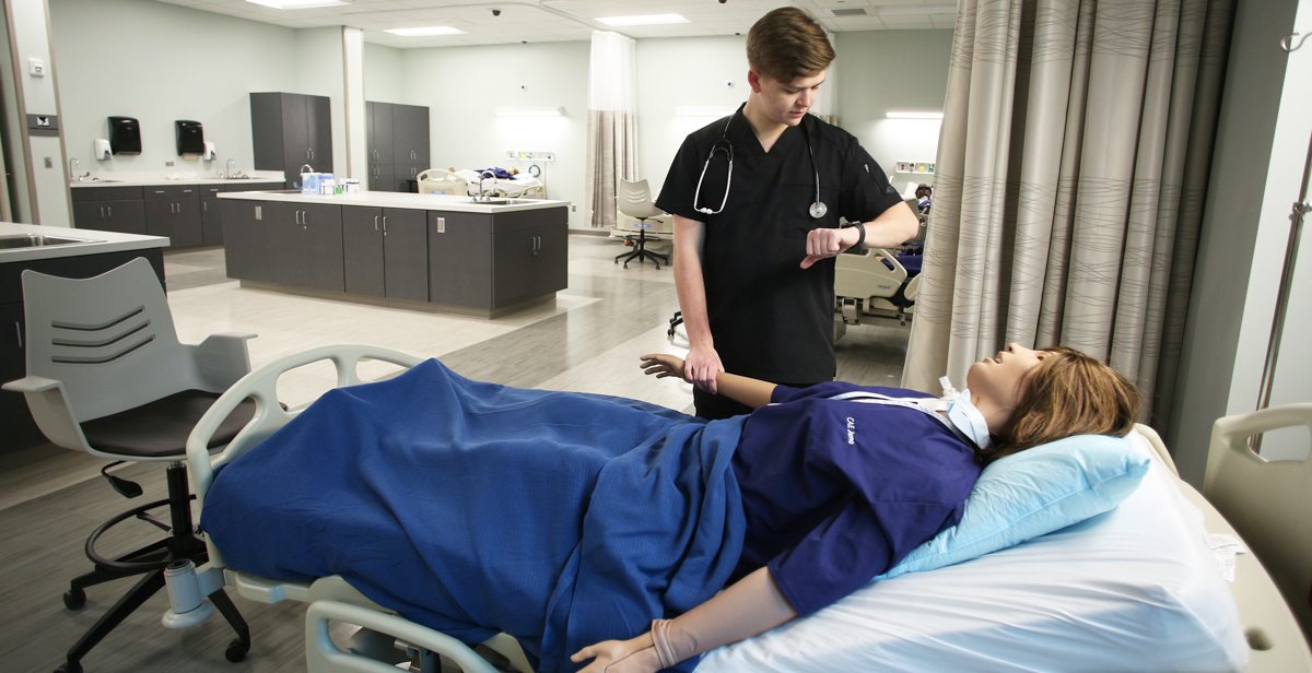Will Rayner, a professional health sciences major from Hoover, Ala., practices on one of the high-tech patient simulators in the new, 39,000-square-foot Health Simulation Building. The facility is used by South's nursing, allied health and medical students. data-lightbox='featured'