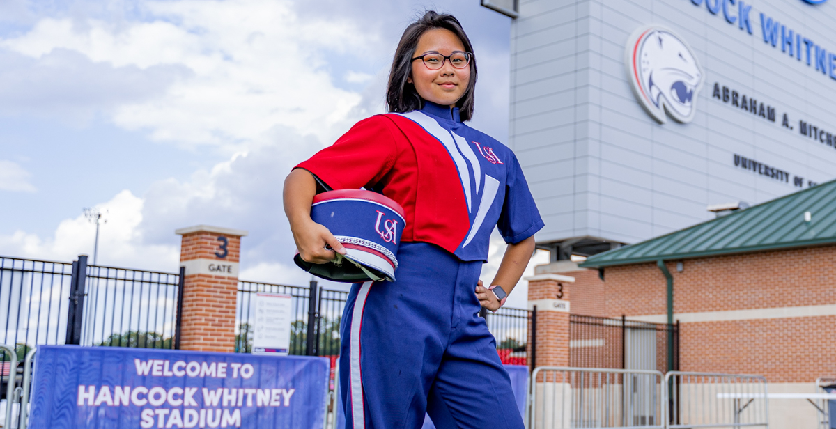 Anita Nguyen, an Honors College freshman, says a lot goes into an on-field marching band routine. The experience is energizing. data-lightbox='featured'