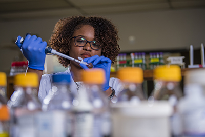 Female working in lab.