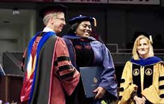 Student receiving diploma at graduation